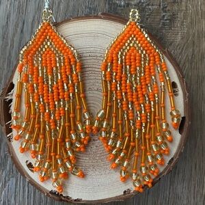 Vibrant handmade chakira bead earrings. Made by artisans in Mexico. 3” length